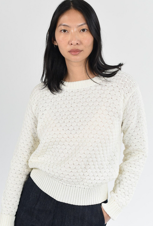 Long sleeve, cotton, crew neck pullover in ivory. Ribbed neck, waist and cuff