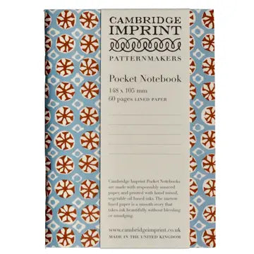 image of pocket size otebook with block print sea urchin design in blue and brown