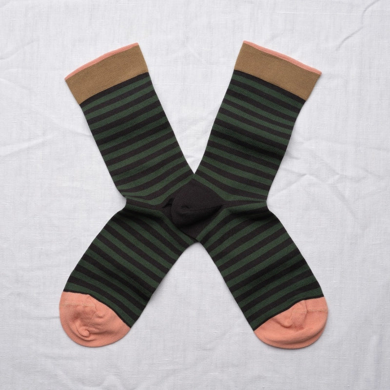 Pair of green striped socks with brown tops and pink toes on a white background