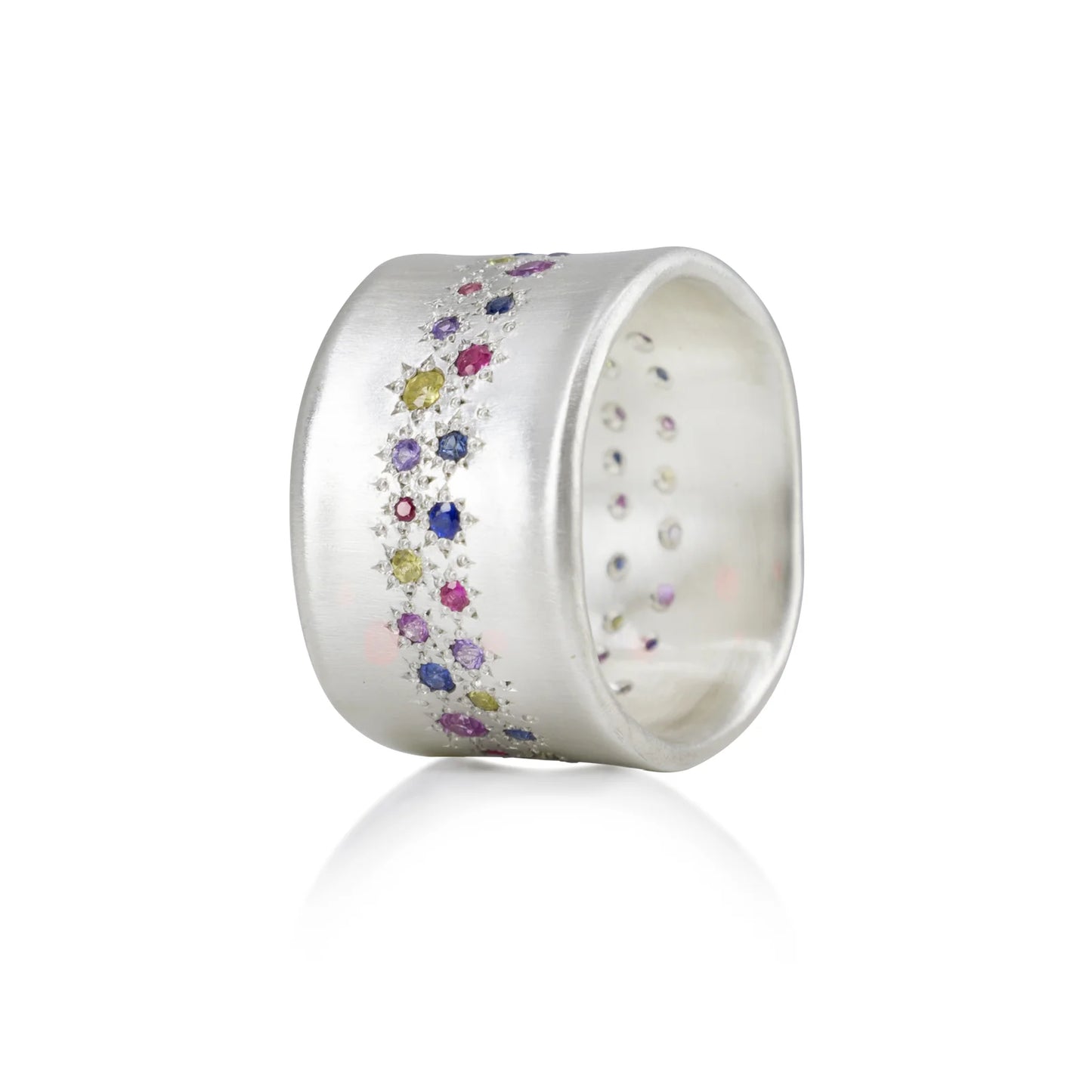 Silver ring with colorful gemstones on a white background