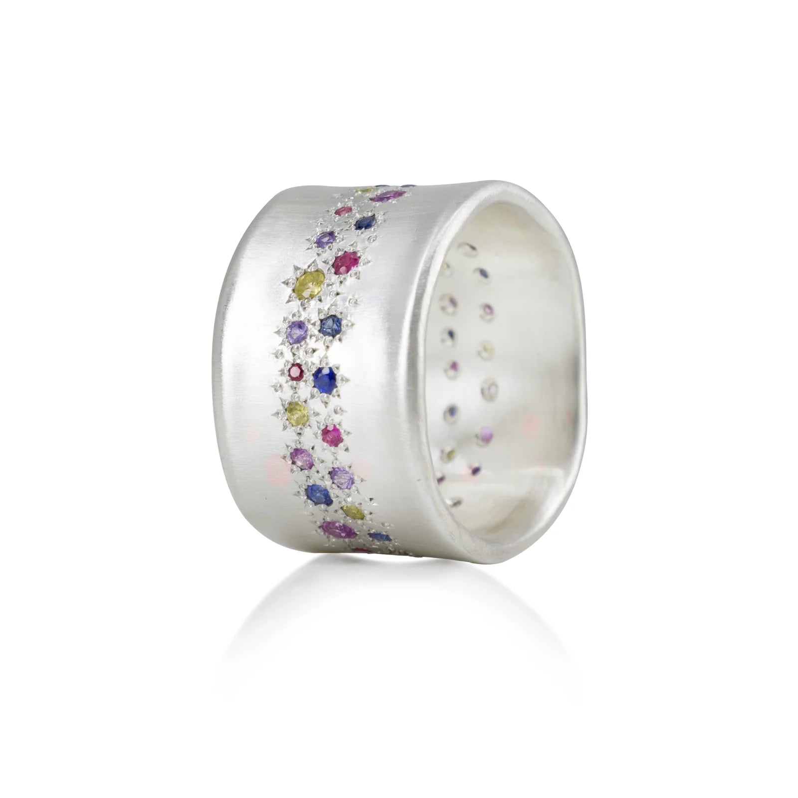 Silver ring with colorful gemstones on a white background