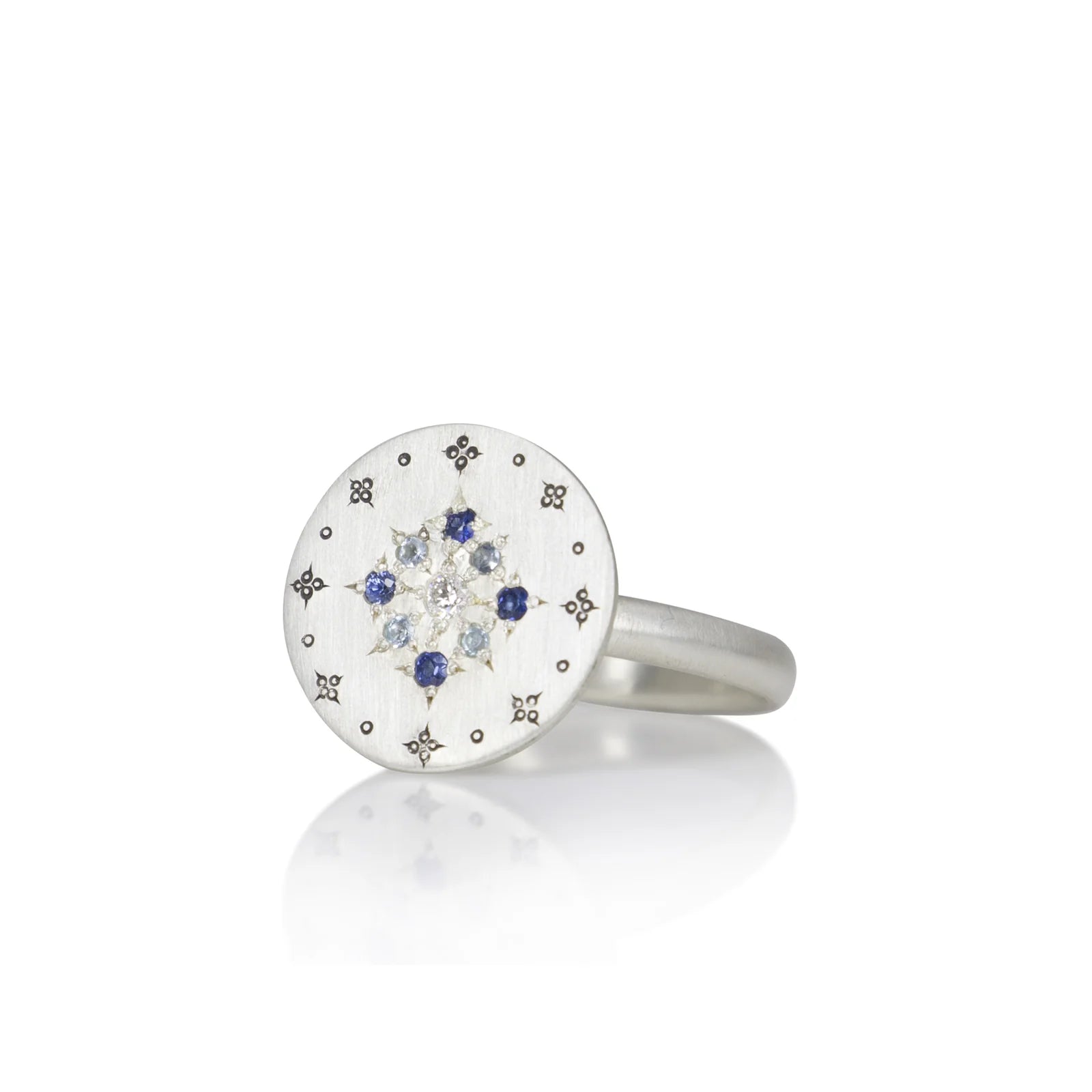 Silver ring with gemstones on a white background