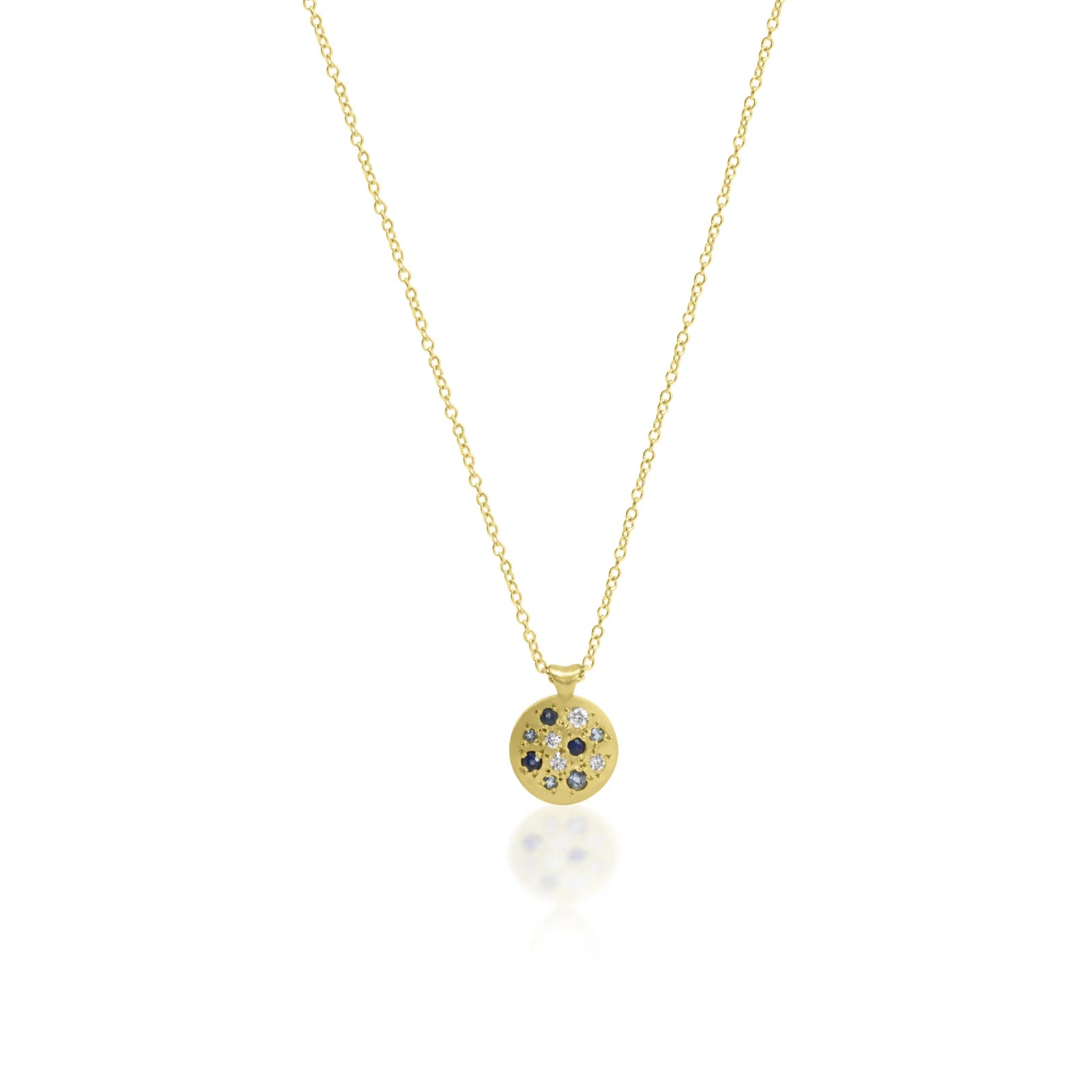 Gold necklace with a round pendant on a white background