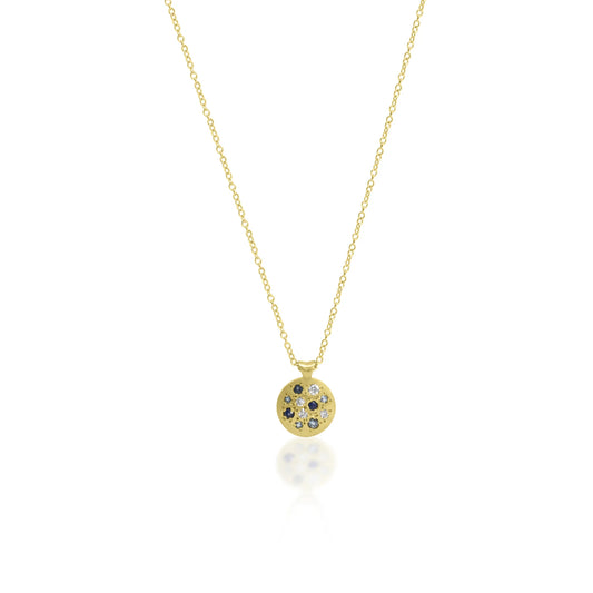 Gold necklace with a round pendant on a white background
