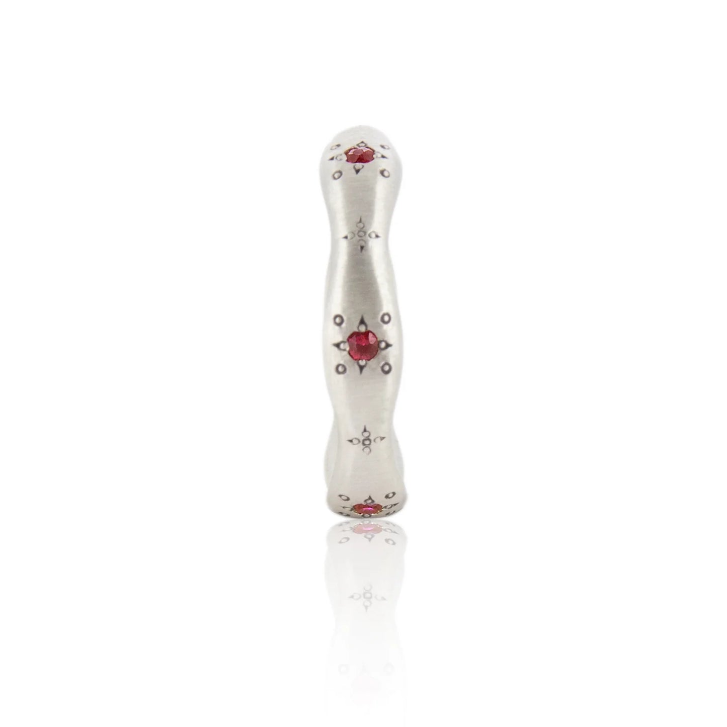 Decorative white object with red heart and black patterns on a white background