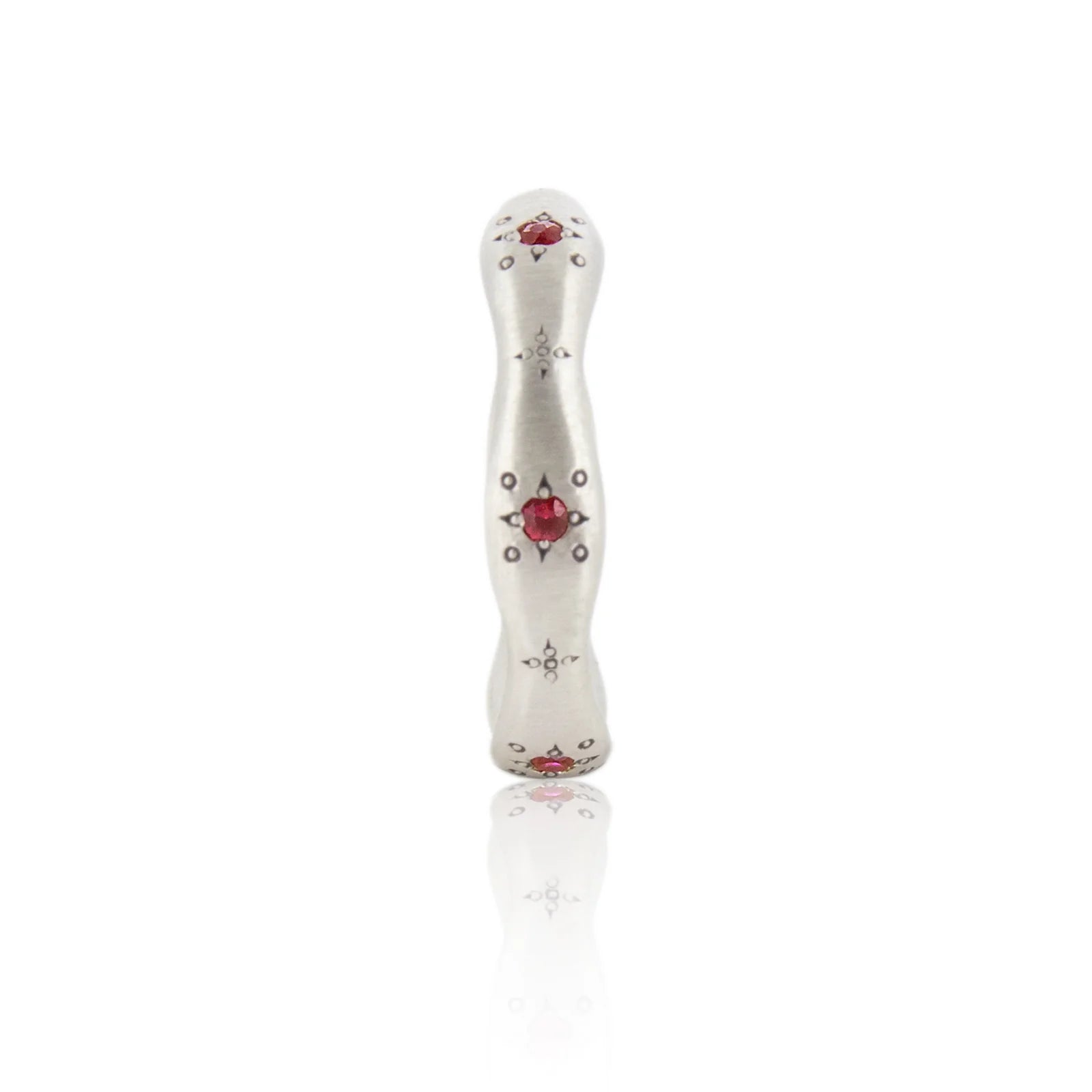 Decorative white object with red heart and black patterns on a white background