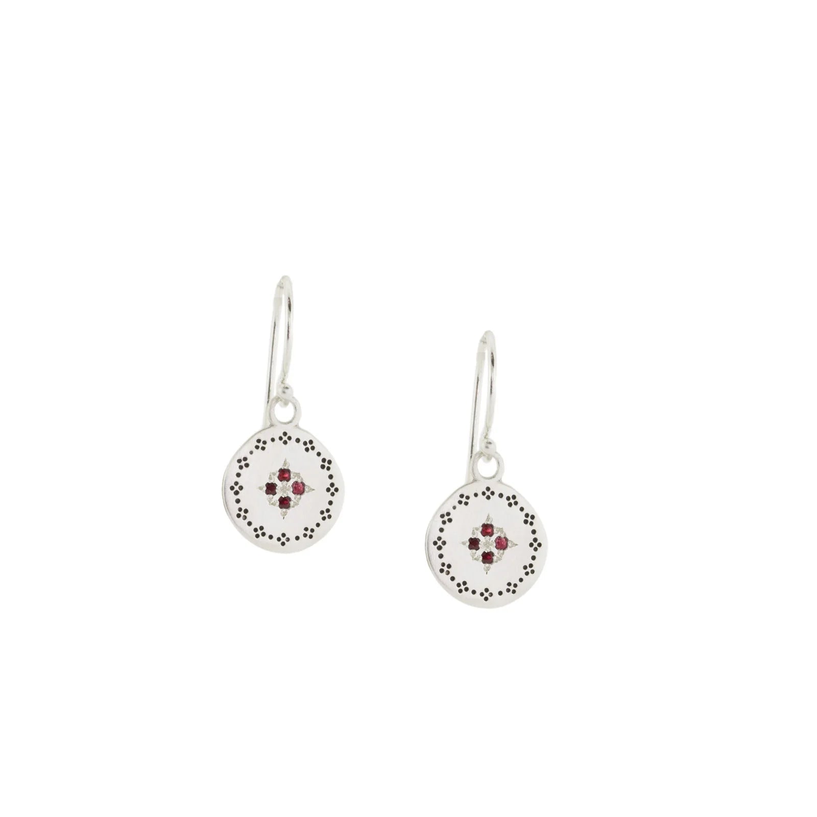 Pair of silver earrings with circular designs on a white background