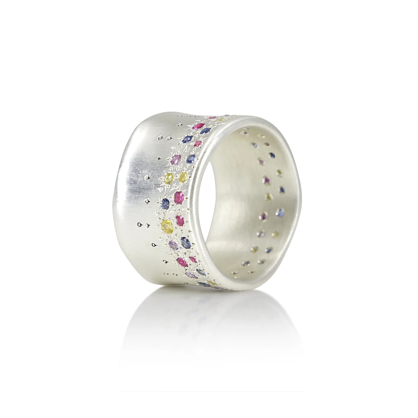 Silver ring with multicolored stones on a white background