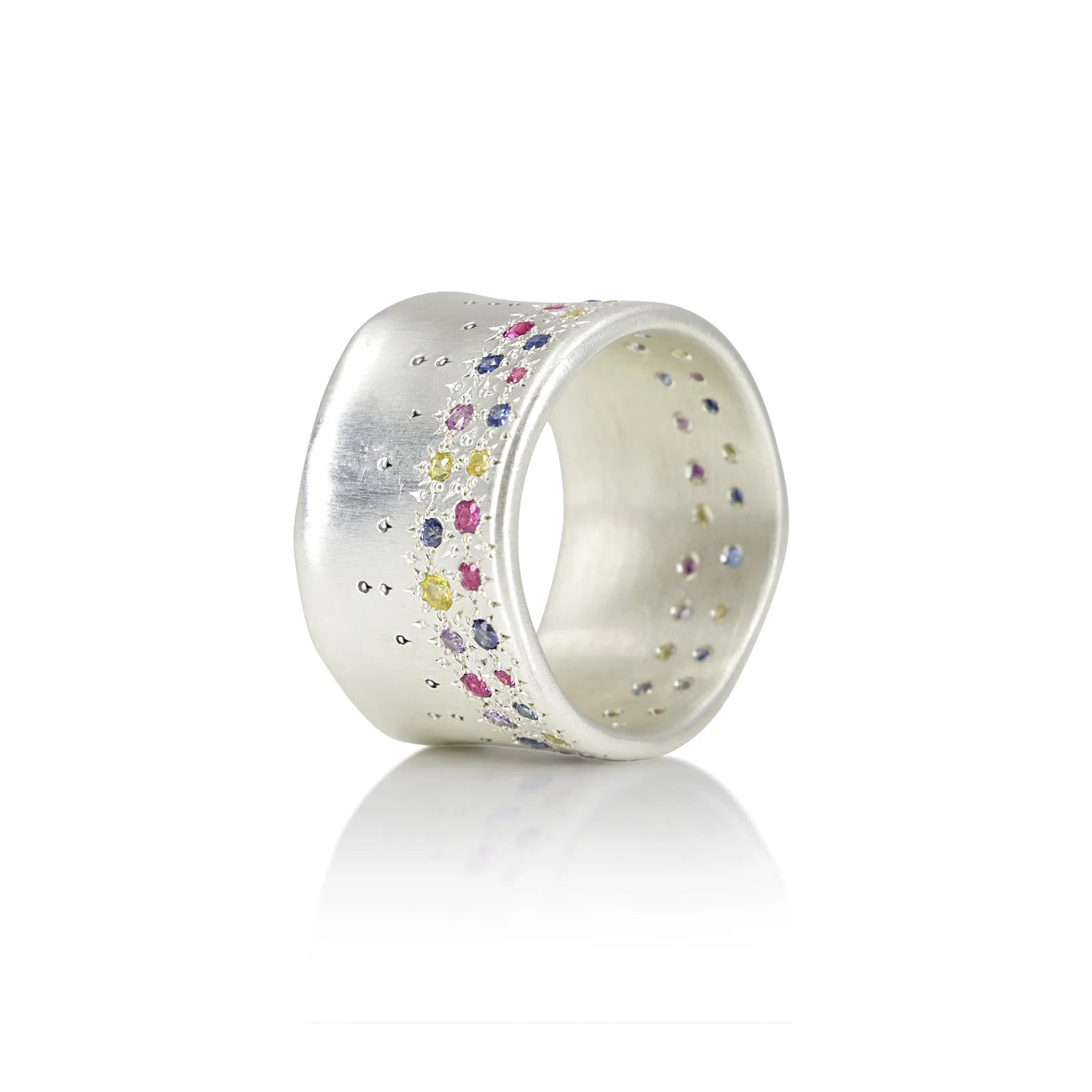 Silver ring with multicolored stones on a white background